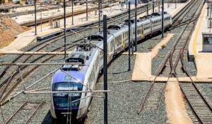 Suburban train chaos after man threatens suicide on power cables