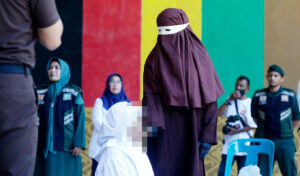Sharia law enforced in Indonesia: Woman faints after 100 lashes