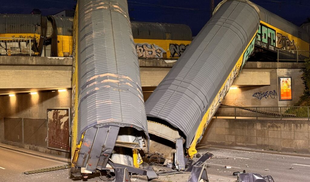 Freight train falls off bridge in Munich, one seriously injured